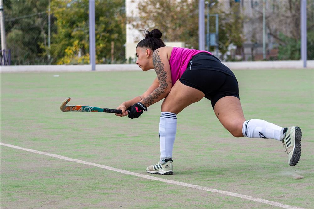 Field hockey player in action, at risk of a sports injury